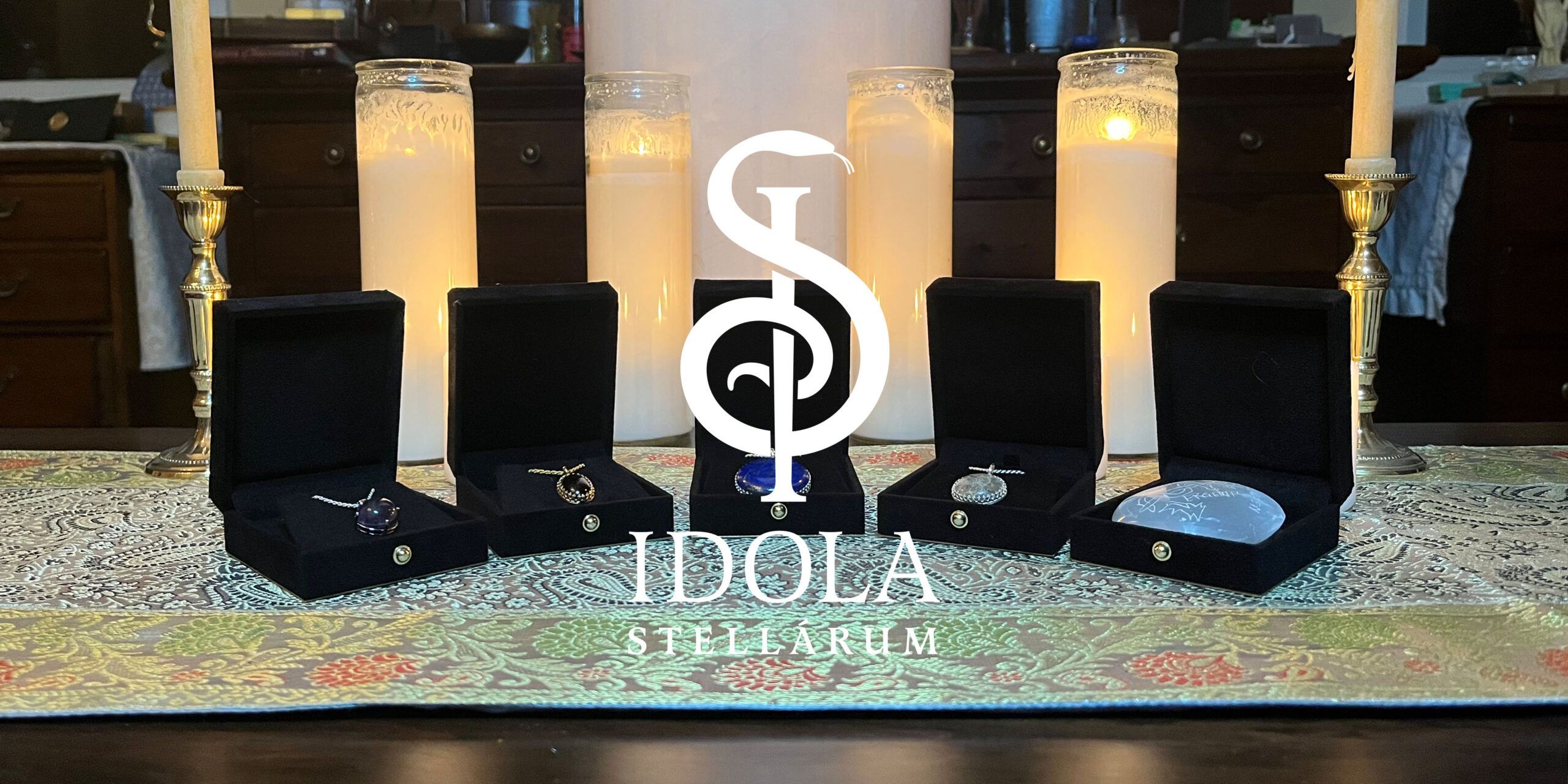 A picture of the five gemstone talismans included in the first Idola Stellarum collection, Sanctuary